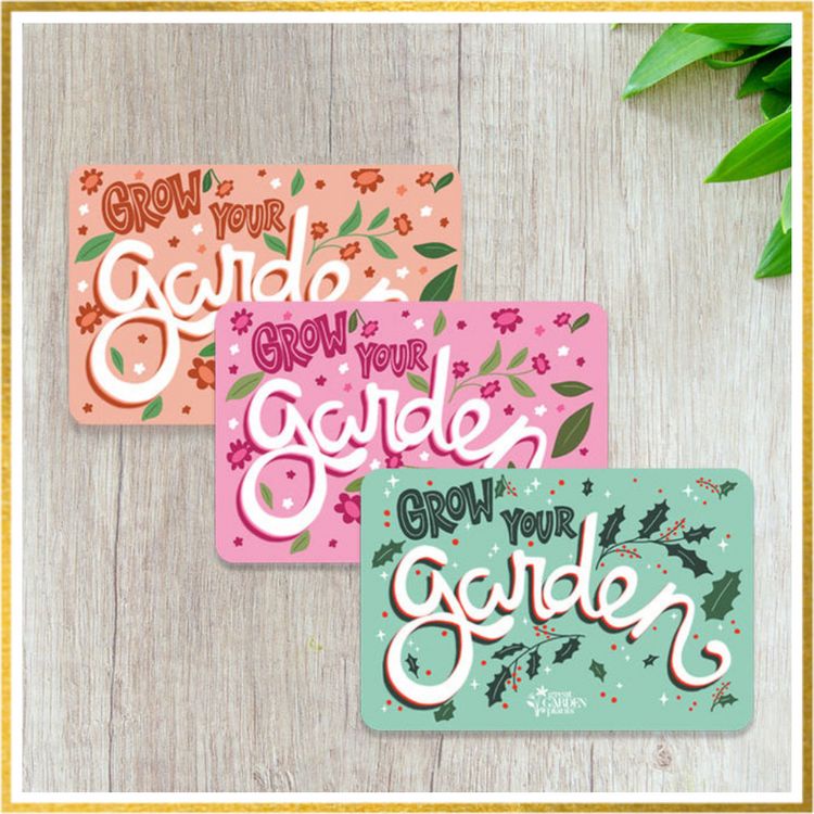 Great Garden Plants gift cards on a wood table