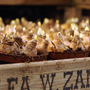 Tete-a-Tete miniature daffodil bulbs in a wooden crate with a blurred background
